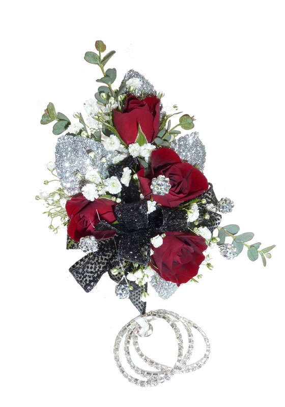 This petite red rose wrist corsage comes with a keepsake bracelet.